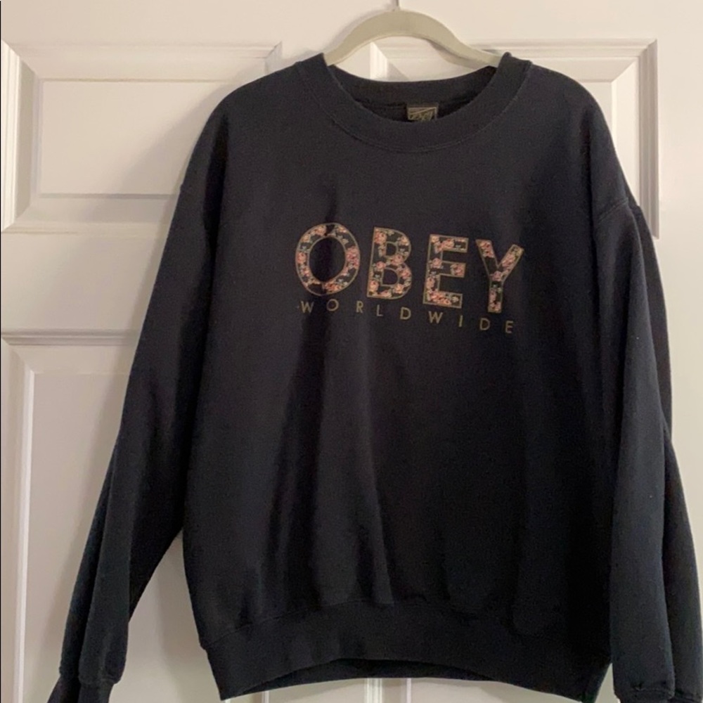 OBEY with flowers in writing